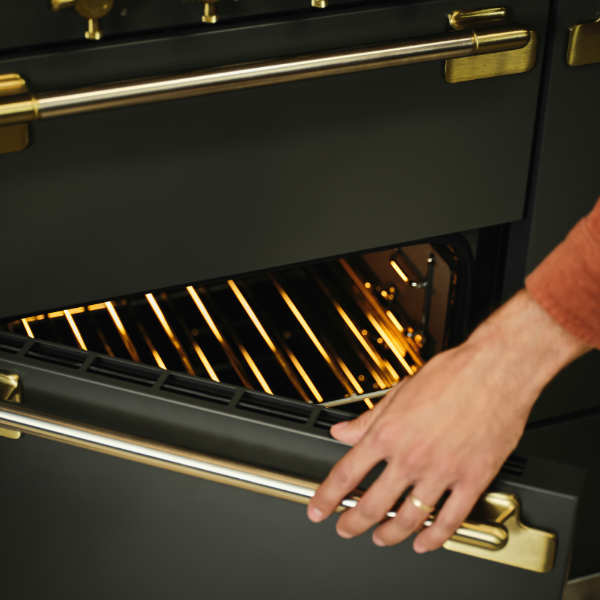 	Rangemaster Elise Luxe 110 Induction Range Cooker in Black with Black / Antique Brass TrimTVCloseup