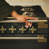 	Rangemaster Elise Luxe 110 Induction Range Cooker in Black with Black / Antique Brass Trimclose
